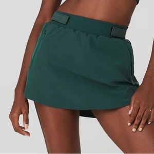 Alo high waisted elevation mini skirt in a size xs